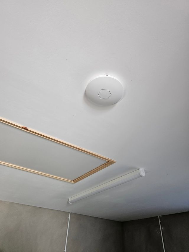 Ceiling-mounted Wi-Fi access point in a home